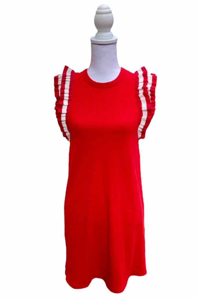 ribbed red mini dress with white and red ruffle sleeves on a mannequin.