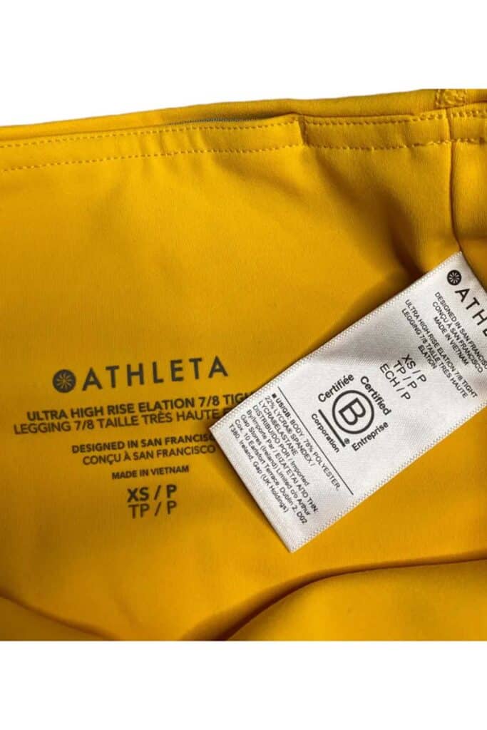 yellow athleta leggings close up of the size tag.