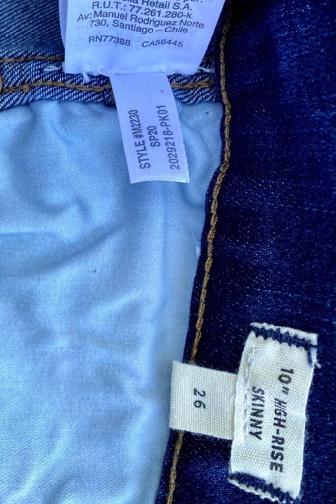 close up of the inside of a pair of madewell jeans showing the size and style number.