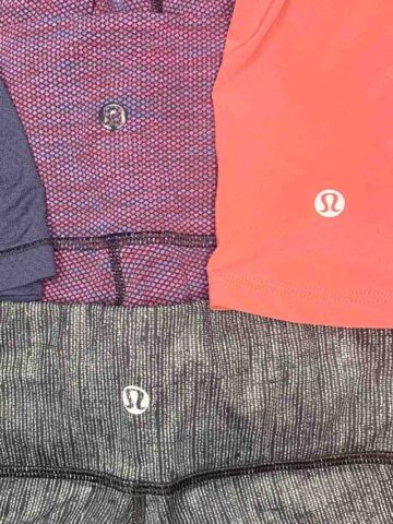 close up of the lululemon logo on four different apparel items.