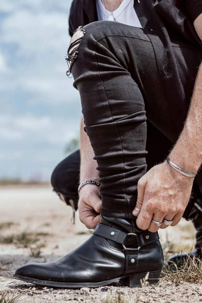 man wearing black leather boots.