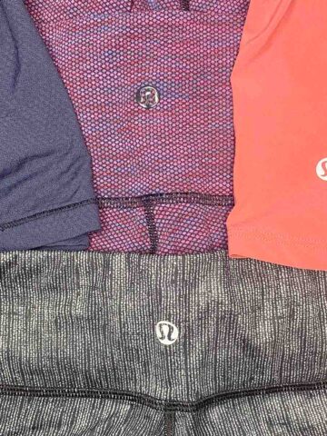 close up of the lululemon logo on four different apparel items.