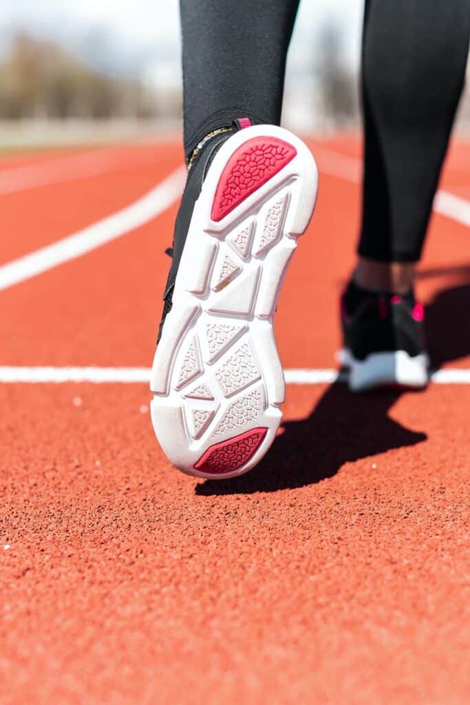 white and pink outsole of a running shoe.