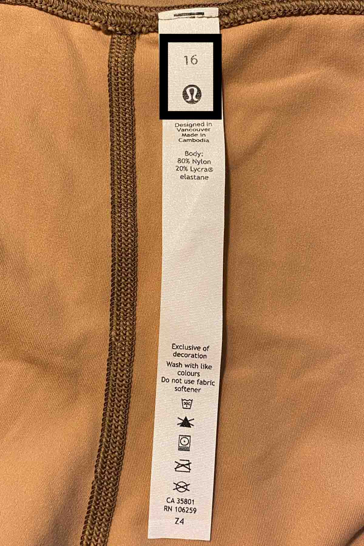 a lululemon rip tag with a black box around the size and logo.