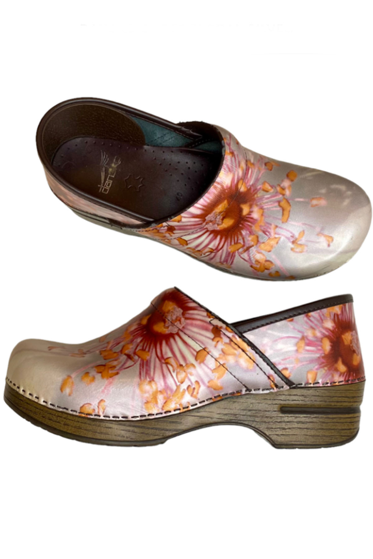 a pair of floral dansko shoes.