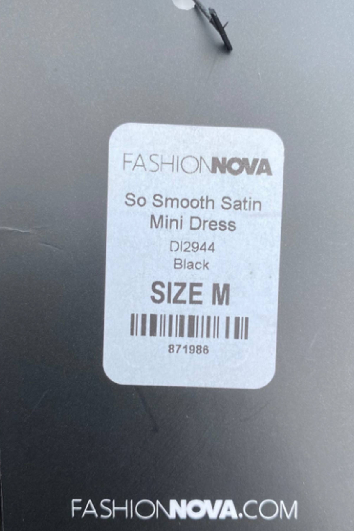 close up of a fashion nova price tag.