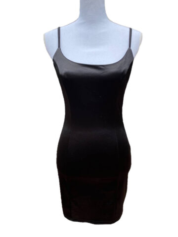 a black satin mini dress on a white mannequin.