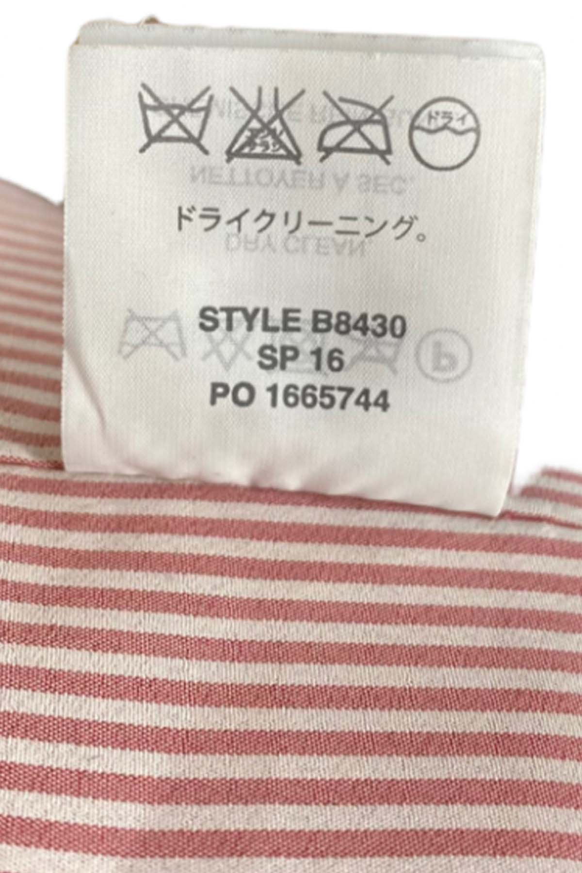 close up of a j crew style number tag.