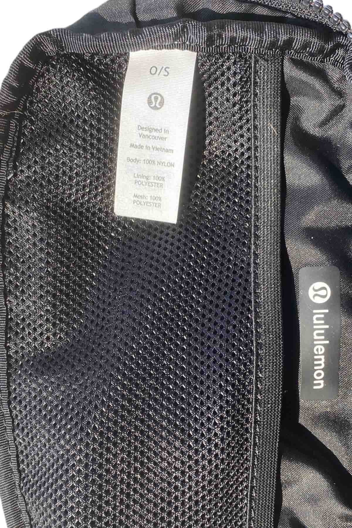 picture of the inside tag of a black lululemon belt bag.