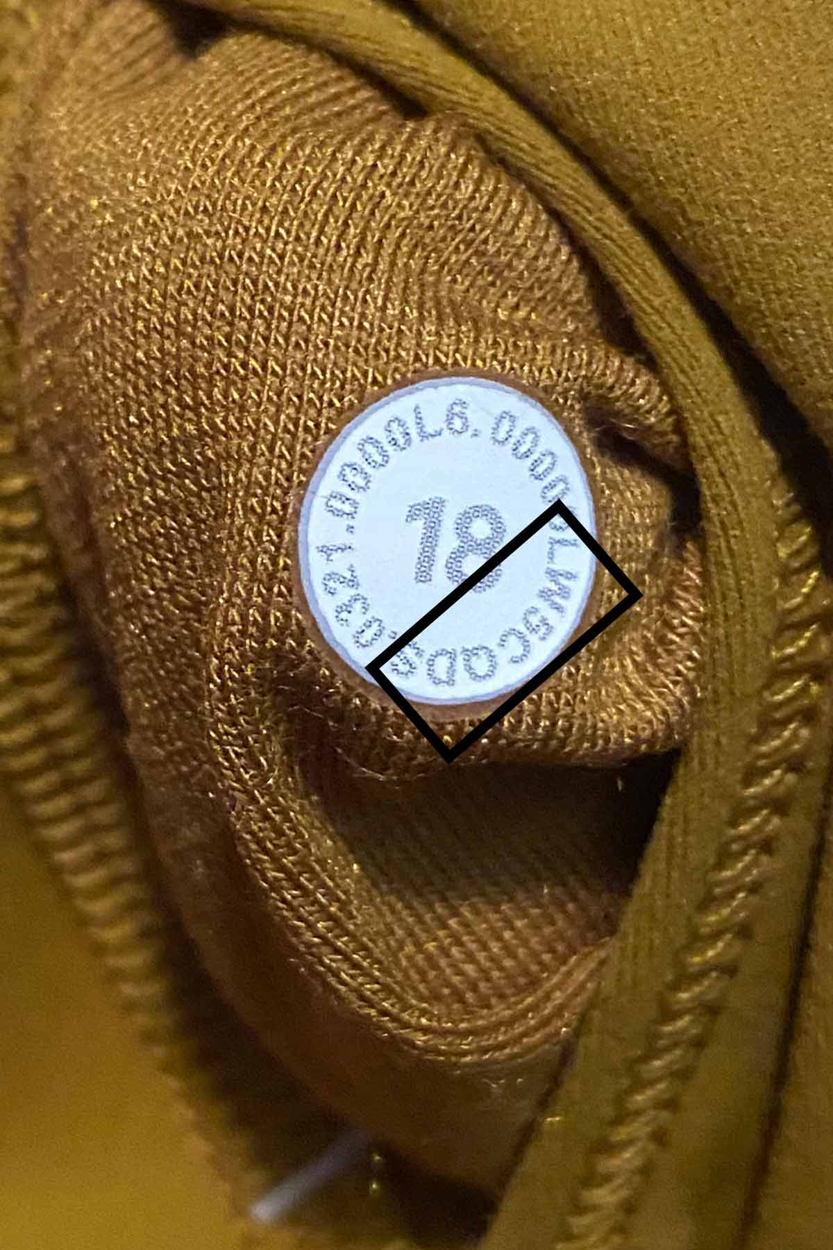 up close picture of a lululemon size dot with the style number outlined in a black box.