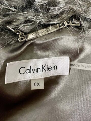 a calvin klein brand and size tag close up.
