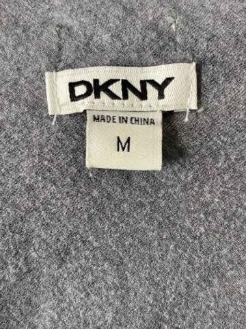 up close picture of the size tag of a dkny dress.